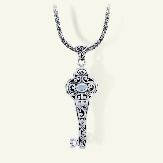 Sterling Silver Key Pendant with Blue Topaz