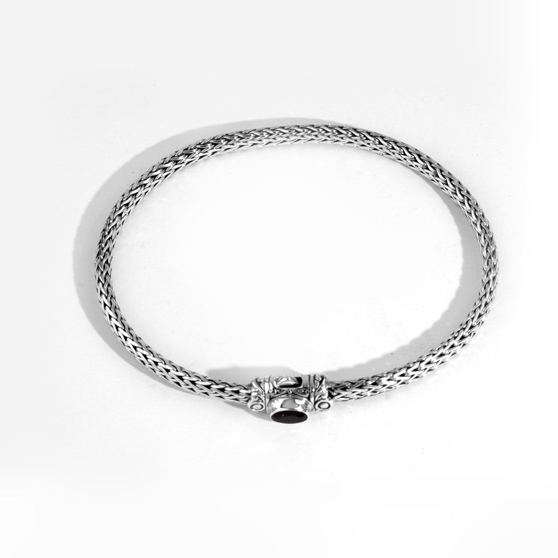 Handwoven Silver Bracelet with Red Gemstone Accent