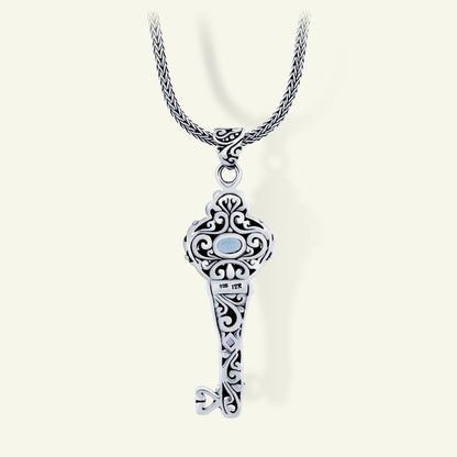 Sterling Silver Key Pendant with Blue Topaz