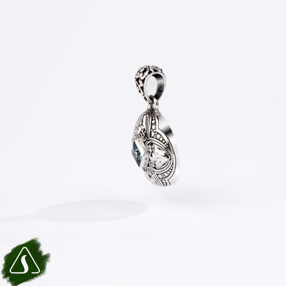 Sterling Silver Round Pendant with Princess-Cut Blue Topaz and Ornate Filigree Design