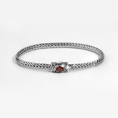 Handwoven Silver Bracelet with Red Gemstone Accent